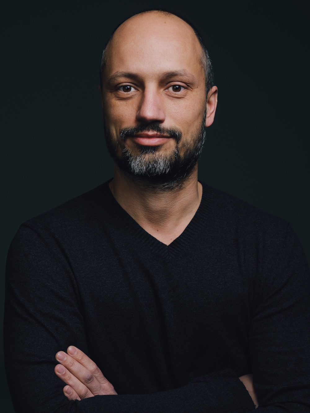 Jürgen Pertak looks into the camera with his arms crossed.
